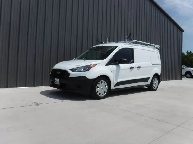 Plain white painting company van before Landmark Painting wrap