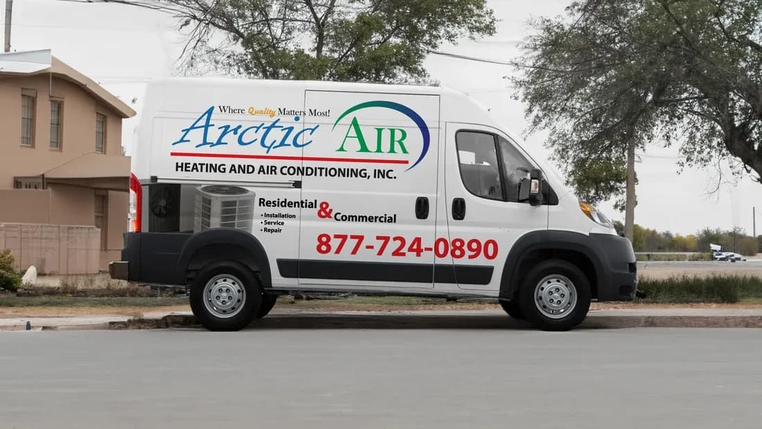 Arctic Air Heating and Air Conditioning van before its rebrand, with a thin script logo, the trade in small capitals, and a short service list