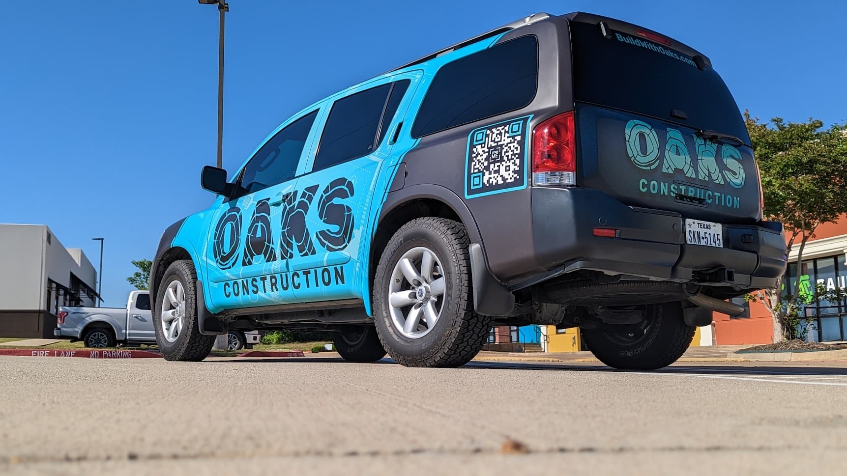Oaks Construction vehicle wrap by WrapMasters