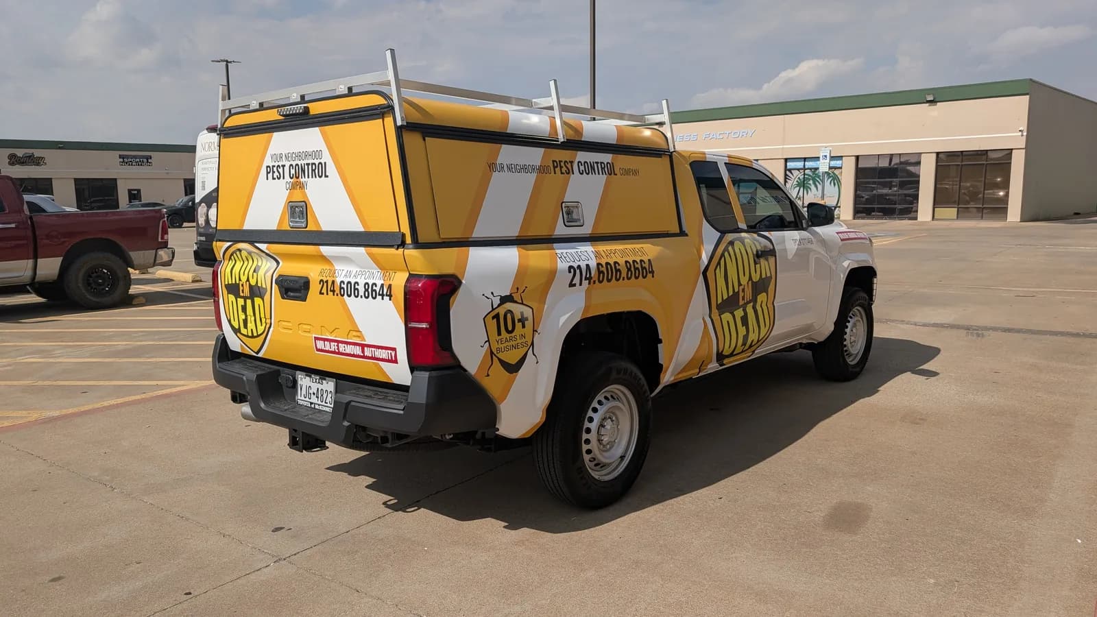 Knock Em Dead Pest Control truck wrap rear quarter view by WrapMasters