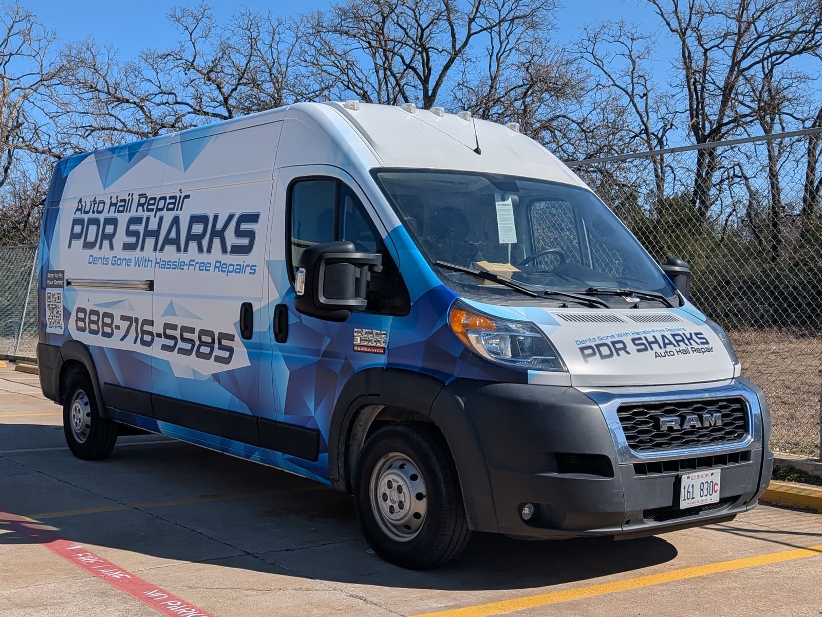PDR Sharks auto hail repair van with a large phone number and the line Dents Gone With Hassle-Free Repairs