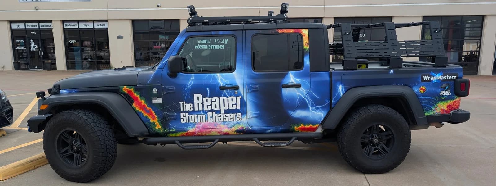 The Reaper Storm Chasers side panels printed and laid out in the WrapMasters shop before installation