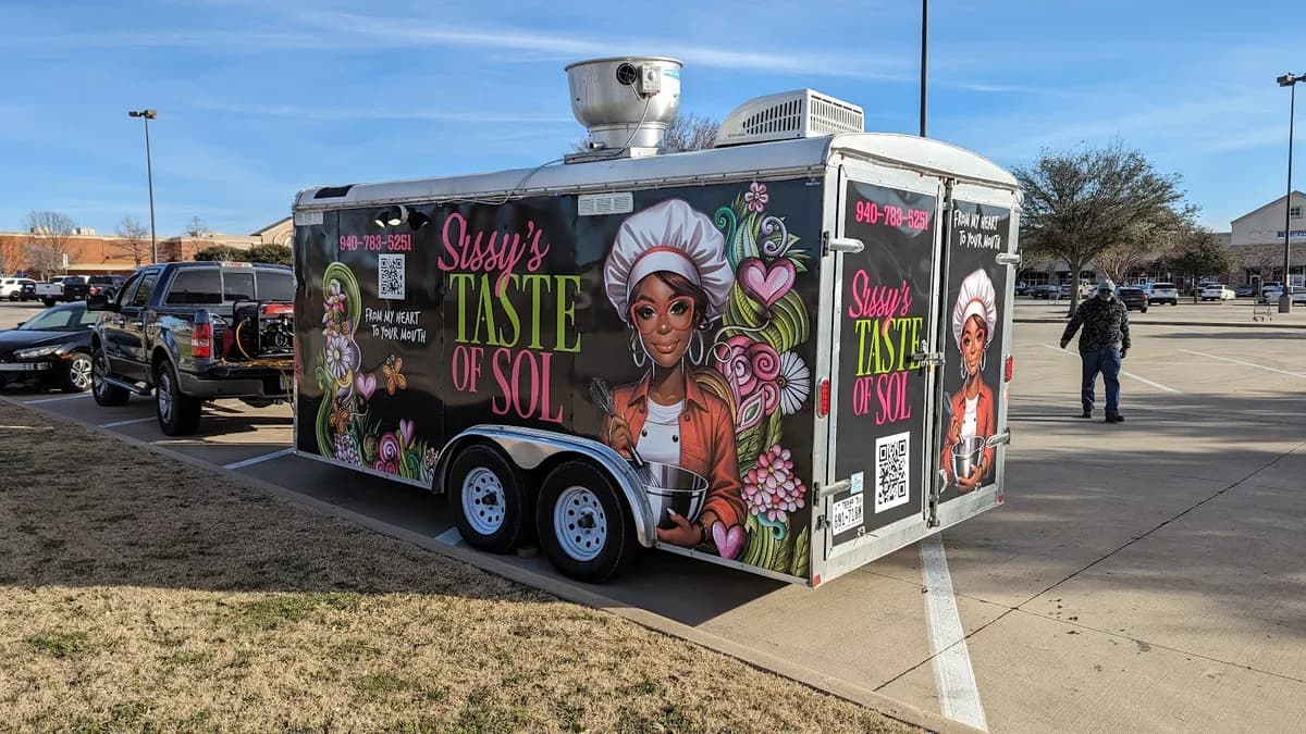Sissy's Taste of Sol trailer rear doors carrying the company name, phone number, tagline, and a QR code placed low in the layout